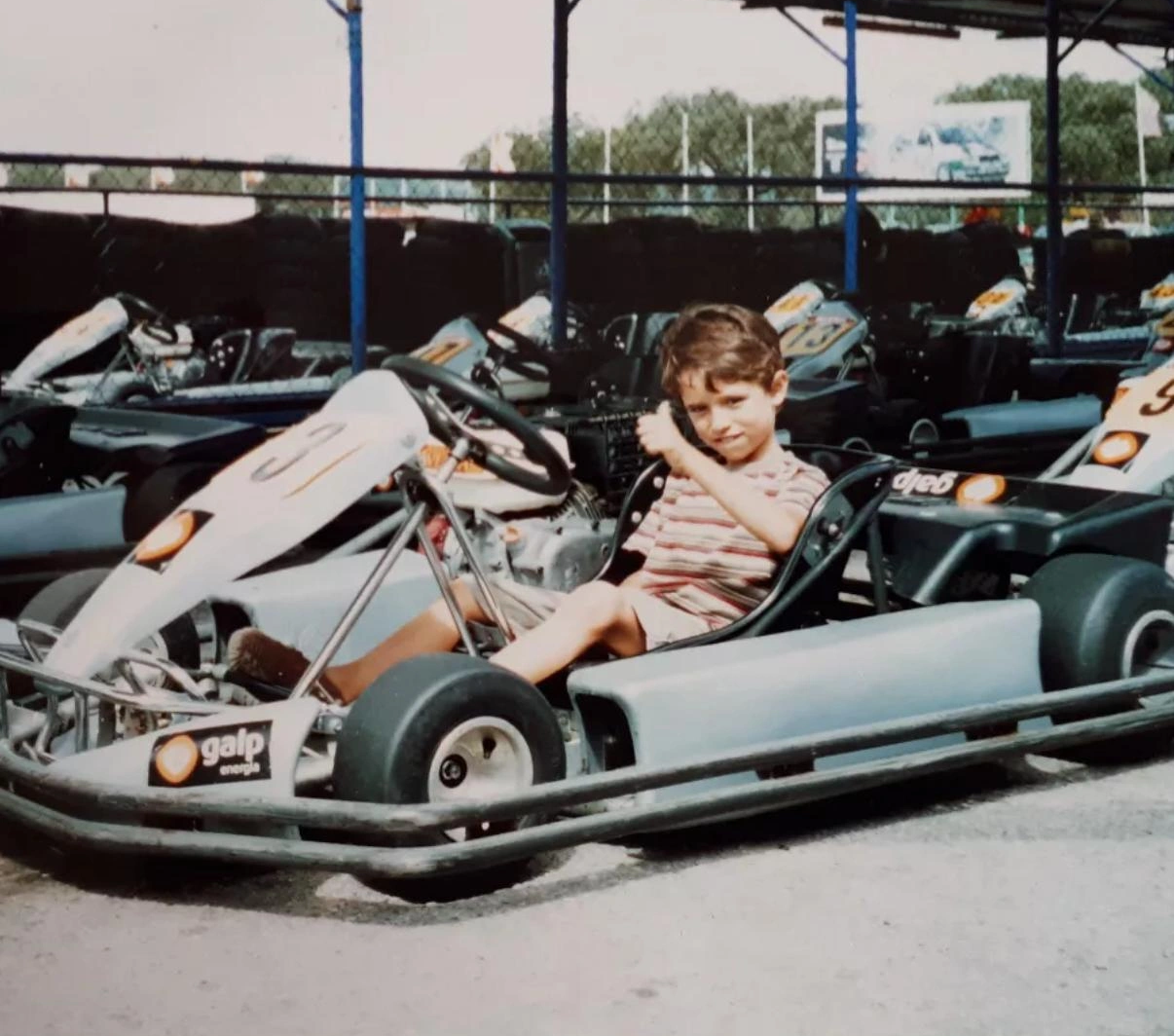 Miguel Gaspar as a child sitting in a kart